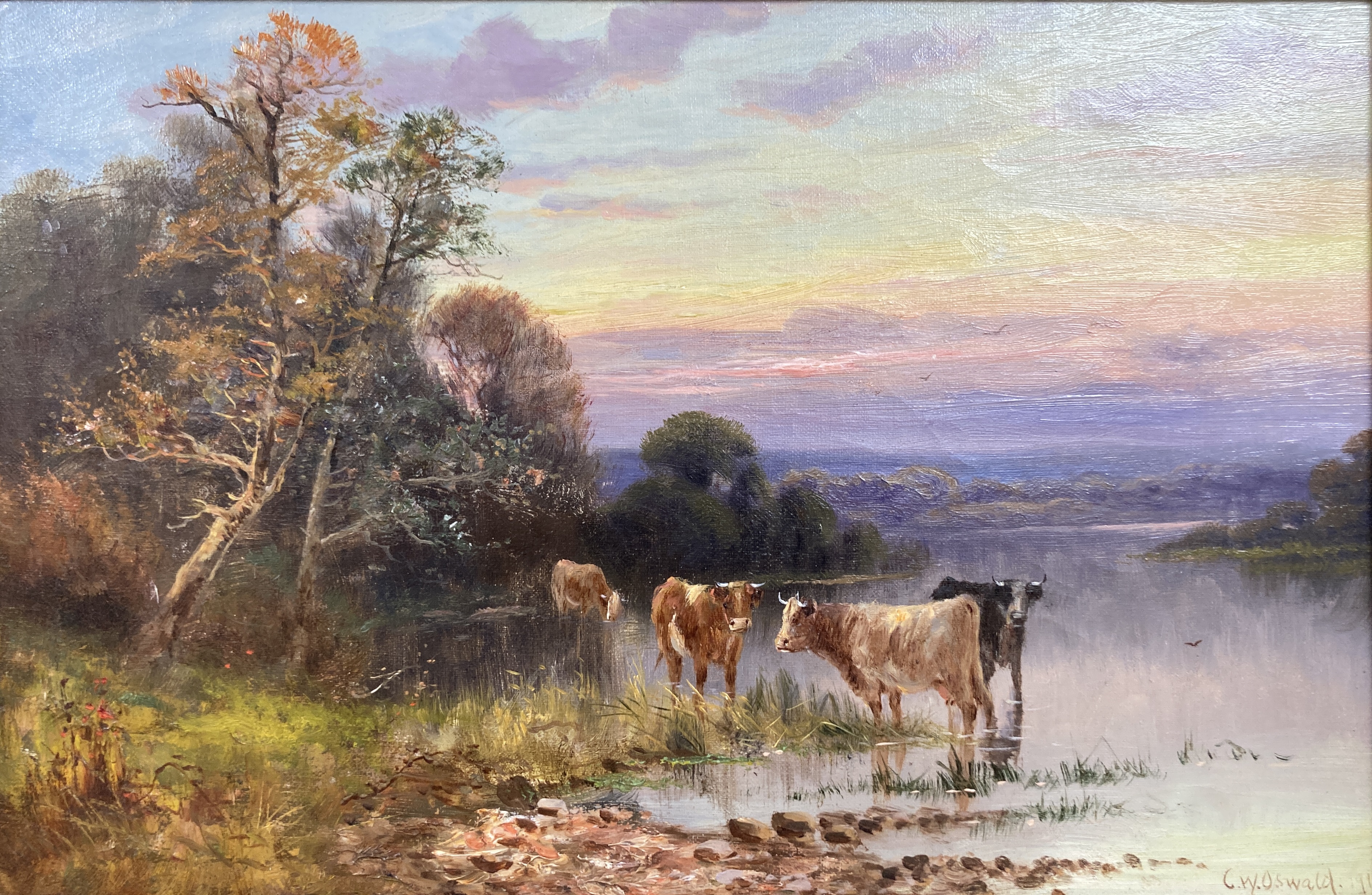 Charles W. Oswald (fl.1892-1900), oil on canvas, Cattle watering at sunset, signed and dated 1910, 29 x 44cm